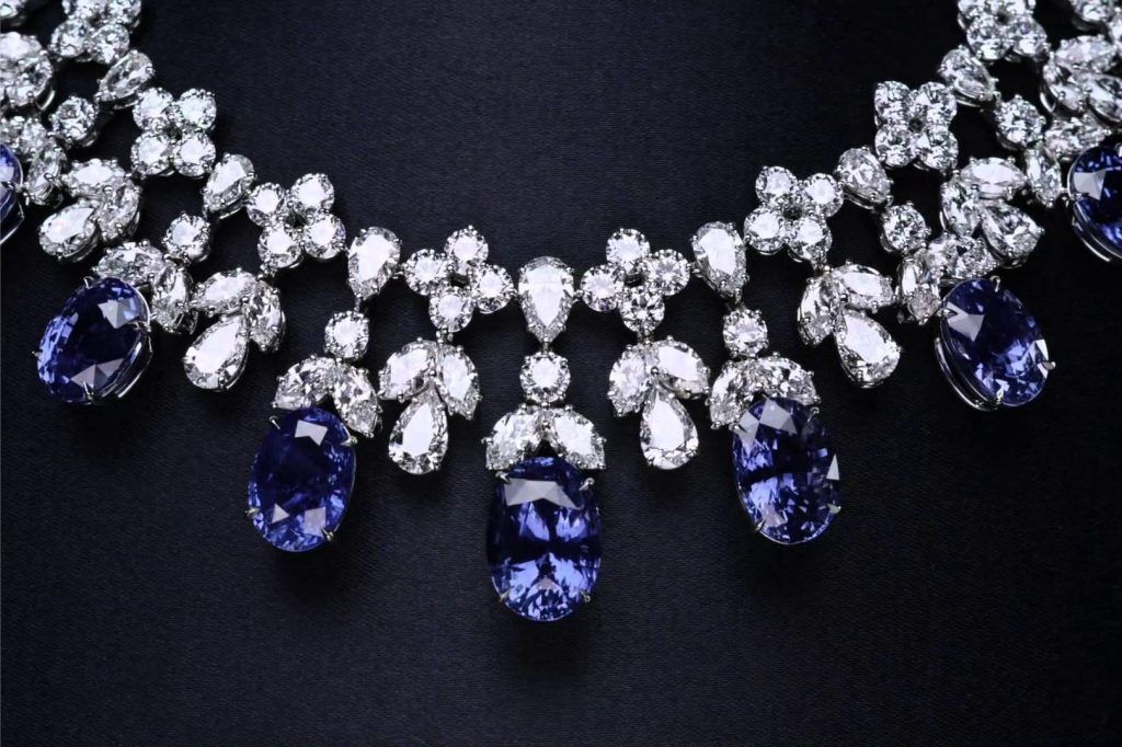 blue-white diamond necklace for women in black backdrop
